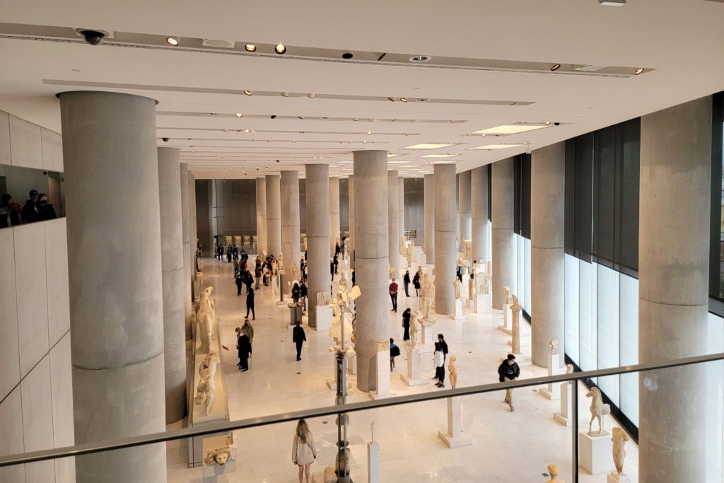 This is an image of the Acropolis Museum in Athens, Greece. It is a birds-eye view of various ancient Greek artifacts. 