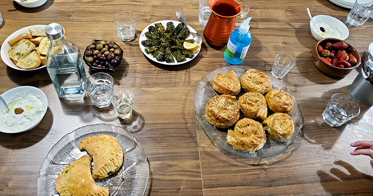 This is an image of a spread of the traditional Greek dishes we made during our class. Traveling and food in Greece. 