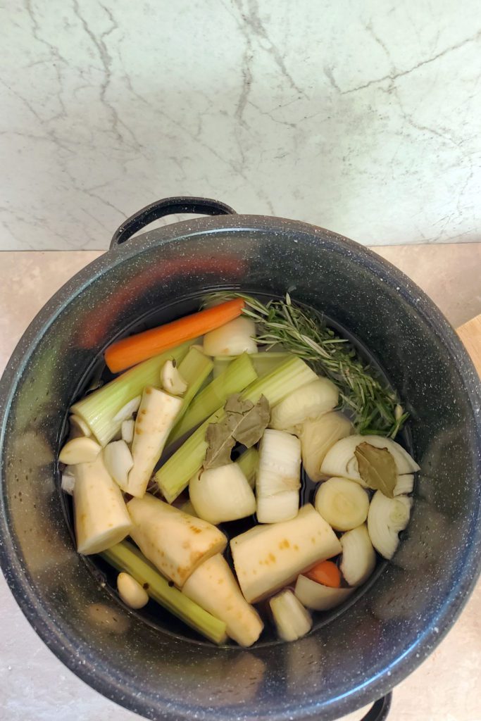 This is an image of the vegetables in a large stock pot ready for simmering to become the vegetable broth.