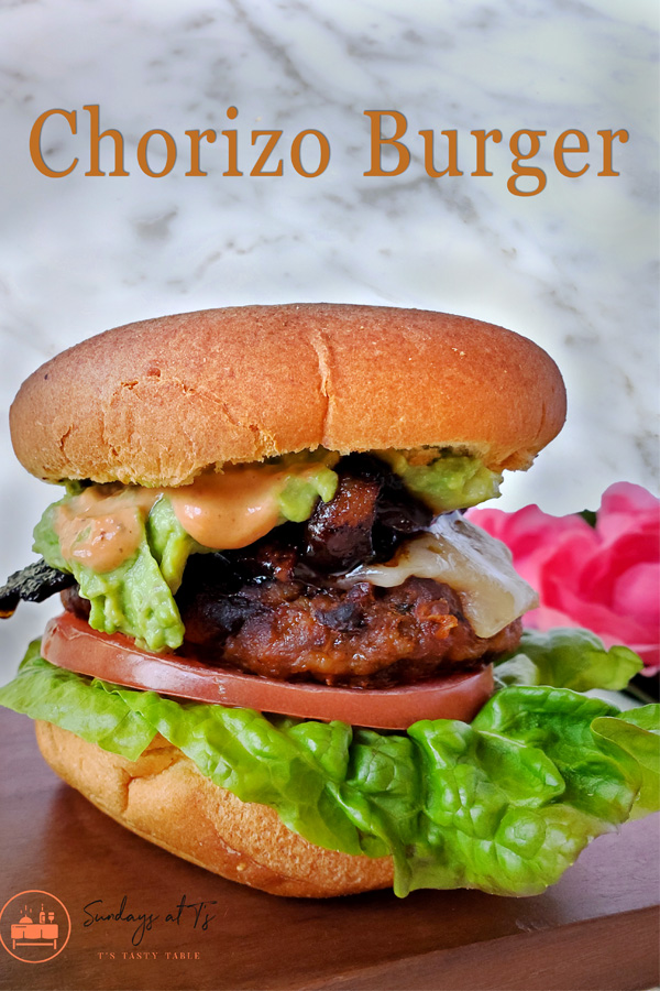 This is an image of the chorizo burger with the sweet sriracha glazed bacon, chipotle mayo, and homemade guacamole. 