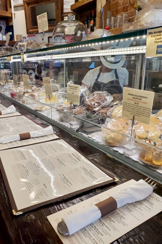 This is an image of the display of gluten-free pastries and desserts at Senza Gluten by Jemiko Café and Bakery in New York City.