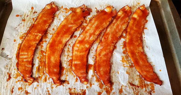 This is an image of the bacon after par-cooking method and glazed.