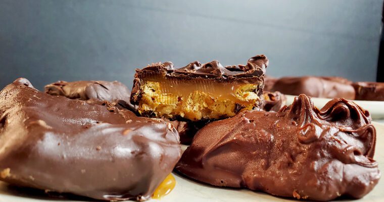 This is an image of the copycat take5 for Sundays at T's. Layered with pretzel, caramel, salted peanuts, peanut butter, all covered in chocolate.