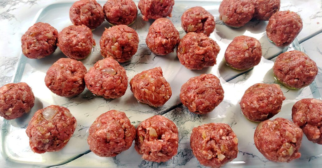 This is an image of the mango BBQ meatballs before baking and before being tossed with the mango BBQ sauce from Pepper Palace. A simple gluten-free appetizer from Sundays at T's.