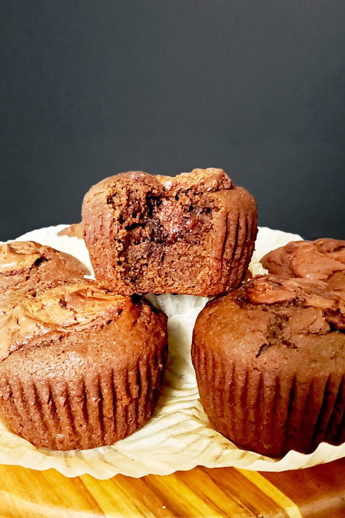 This is an image of the chocolate banana and Nutella muffins from Sundays at T's. The image shows the inside of the muffins with the Nutella oozing out.
