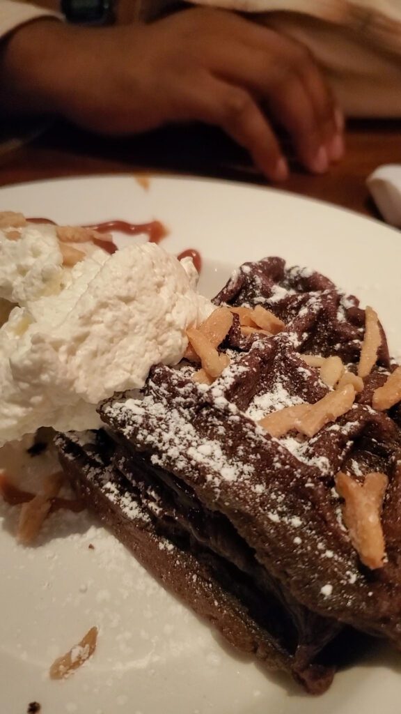 This is an image of the Flourless Chocolate from Coastal Flats in Fairfax, VA. The waffle was served warm with vanilla ice cream.