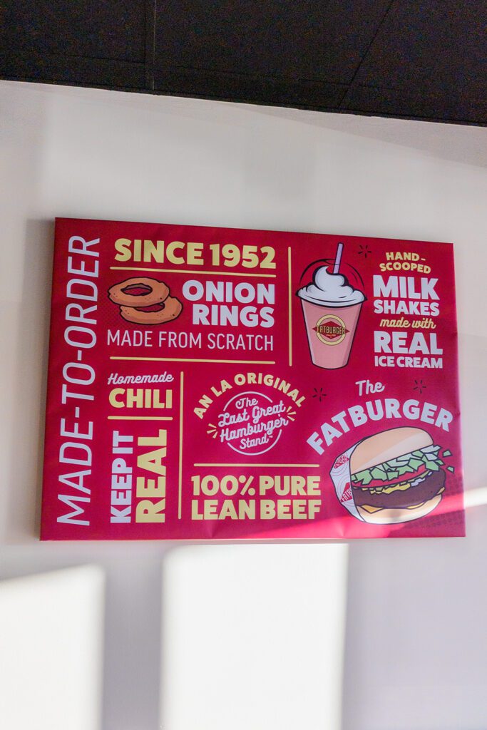 This is an image of a sign that is in the interior of Fatburger and Buffalo's Express in Manassas, Virginia. The sign reads that the food is made-to-order, the chili is homemade, the onion rings are made from scratch, the milkshakes are made with real ice cream, and the Fatburger is made with 100% pure lean beef.