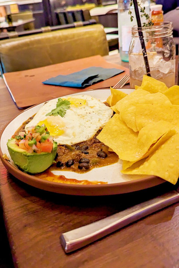 This is an image of the smoked brisket huevos rancheros from Yardbird Table & Bar in Washington, DC.