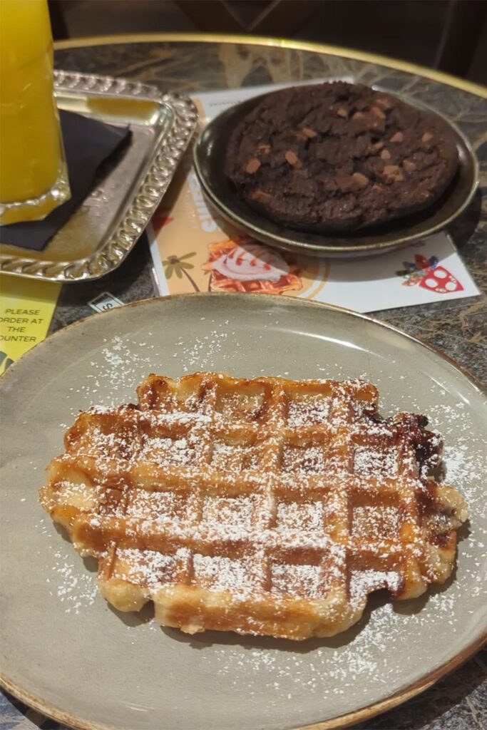 This is an image of a vegan gluten-free Belgian waffle from Aksum in Brussels, Belgium. Gluten-free Belgian foods in Brussels, Belgium.