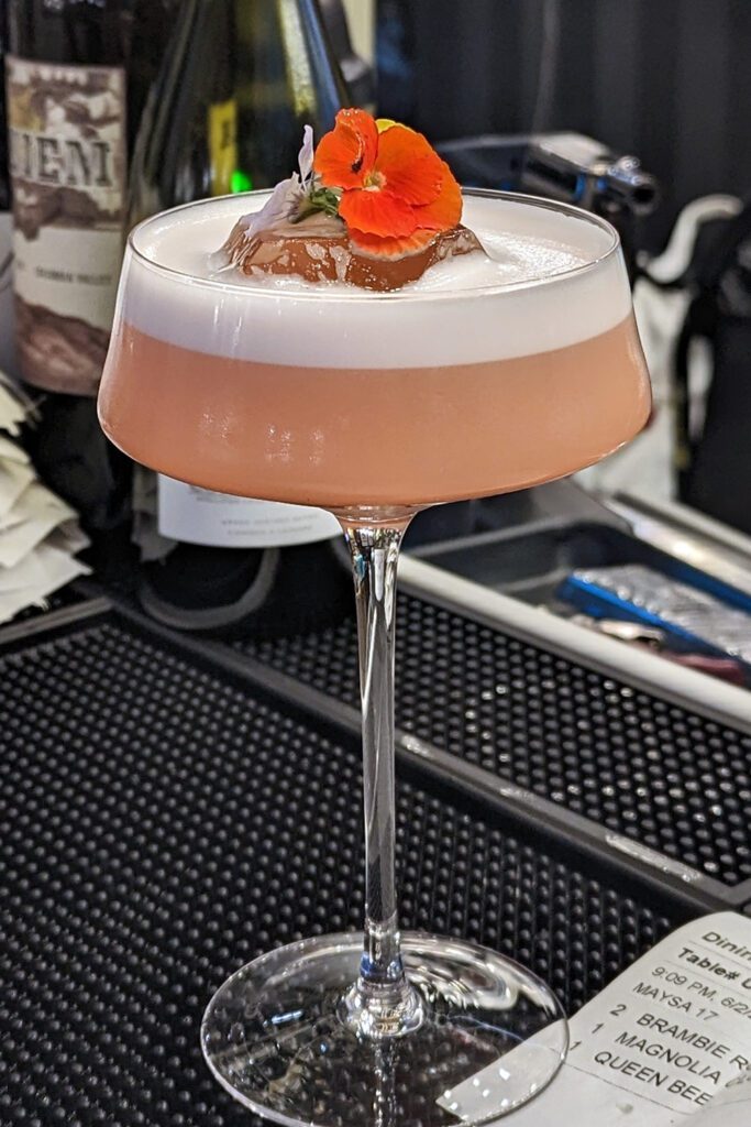 This is an image of the Magnolia Club, a craft cocktail from Sisters Thai Alexandria.