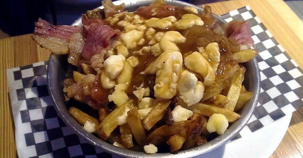 This is an image of poutine taken at one of many restaurants in Montreal, Quebec, Canada.