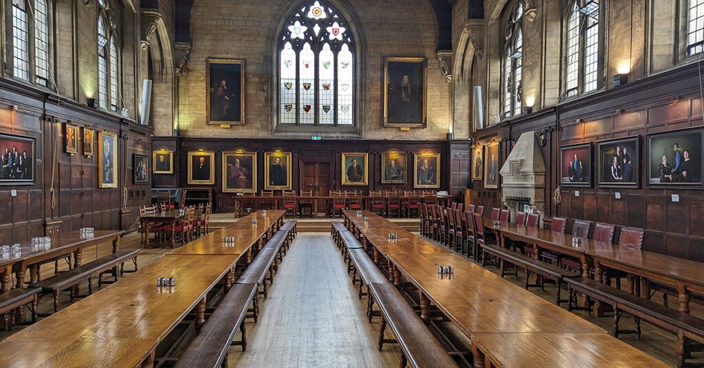 This is an image of Balliol College's dining hall showing the student seating, and the head table for the college's leadership.